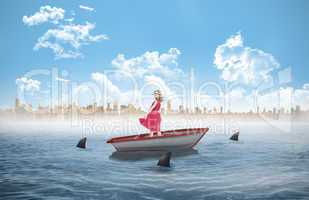 Composite image of smiling blonde turning in a sailboat