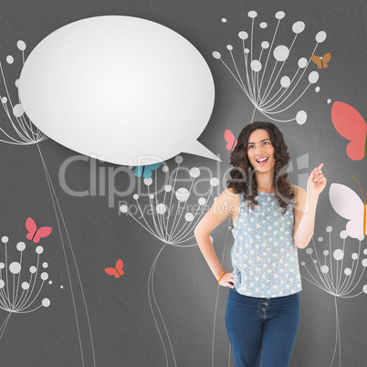 Composite image of happy beautiful brunette posing with speech b