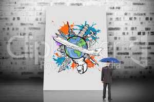 Composite image of businessman holding umbrella