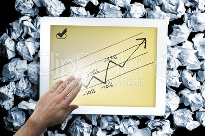 Composite image of hand presenting on tablet