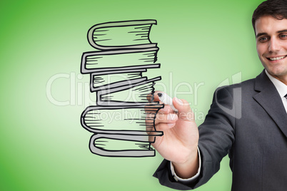 Composite image of businessman drawing books