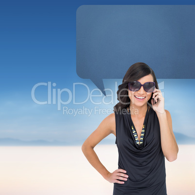 Composite image of happy brunette phoning with speech bubble