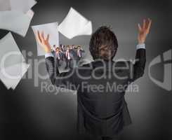 Composite image of gesturing businessman with tiny businessmen