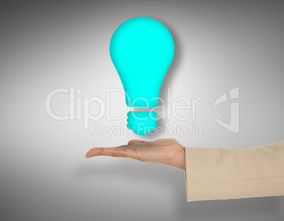 Composite image of female hand presenting light bulb