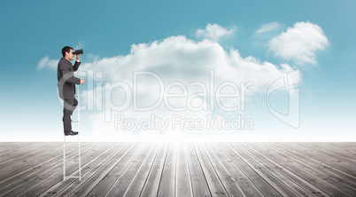 Composite image of businessman standing on ladder