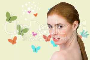 Composite image of beautiful redhead looking at camera