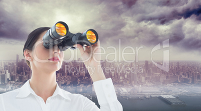 Composite image of business woman looking through binoculars