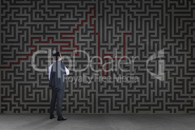 Composite image of businessman standing