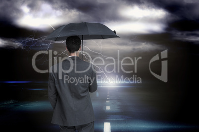 Composite image of rear view of classy businessman holding grey