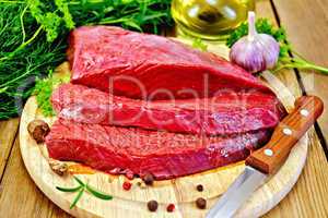Meat beef on board with herbs and spices