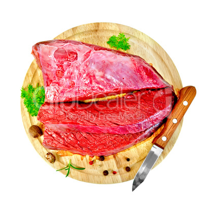 Meat beef with parsley on round board top