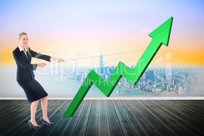 Composite image of businesswoman pulling a rope around arrow