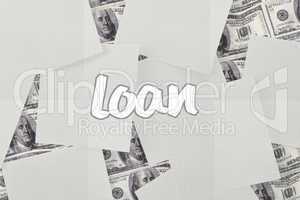 Loan against white paper strewn over dollar bills