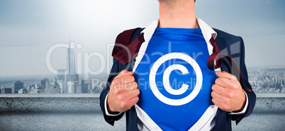 Composite image of businessman opening his shirt superhero style