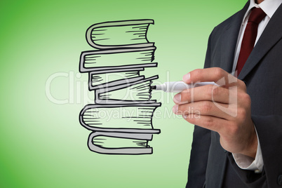 Composite image of businessman drawing books