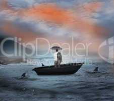 Composite image of businessman standing in a sailboat