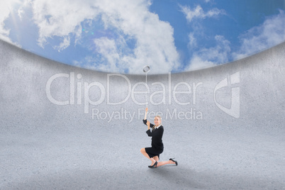 Composite image of businesswoman pulling down blue sky