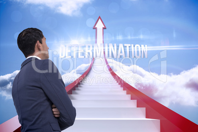 Determination against red steps arrow pointing up against sky