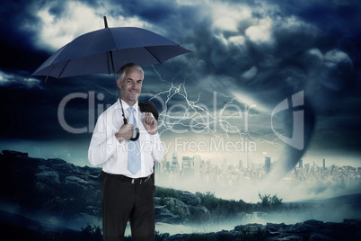 Composite image of happy businessman holding umbrella