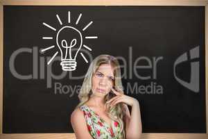 Composite image of frowning pretty blonde wearing flowered dress