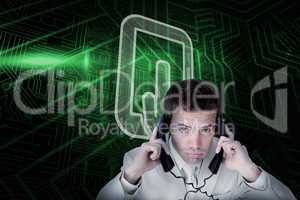 Composite image of tablet pc and businessman tangled in wires