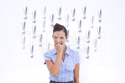 Composite image of furious businesswoman looking at the camera