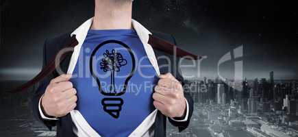 Composite image of businessman opening his shirt superhero style