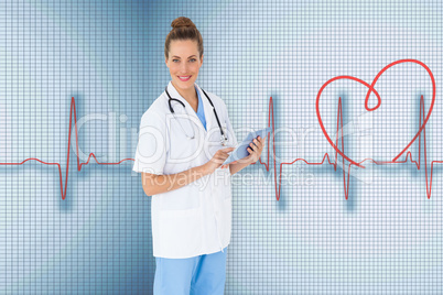 Composite image of pretty nurse using tablet pc