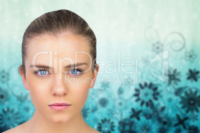 Composite image of serious blonde natural beauty