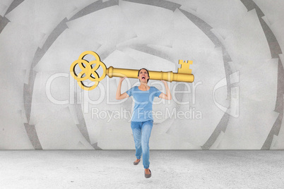 Composite image of annoyed brunette carrying large key