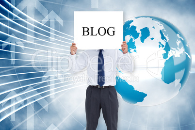 Businessman holding card saying blog