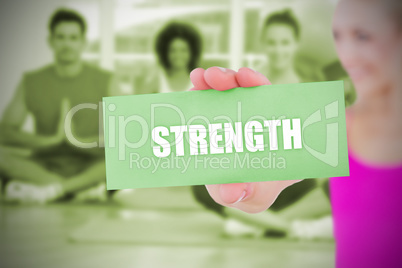 Fit blonde holding card saying strength