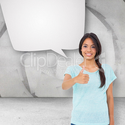 Composite image of happy brunette giving thumbs up