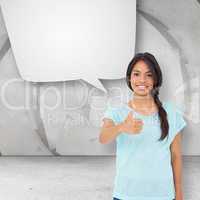 Composite image of happy brunette giving thumbs up