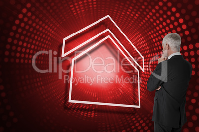 Composite image of house and businessman looking