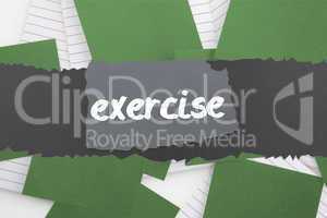 Exercise against green paper strewn over notepad