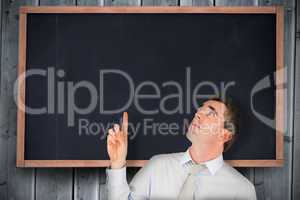 Composite image of business manager pointing