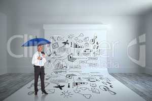 Composite image of happy businessman holding umbrella