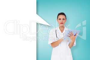 Composite image of pretty nurse using tablet pc with speech bubb