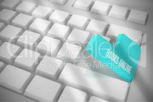 Books online on white keyboard with blue key