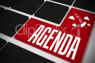 Agenda on black keyboard with red key