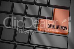Social network on black keyboard with brown key