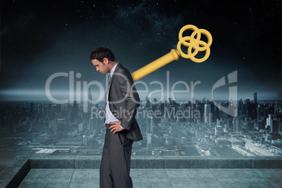 Composite image of wound up businessman with hands on hips