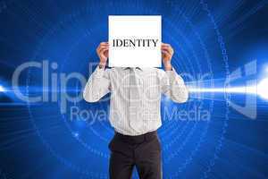Businessman holding card saying identity