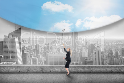 Composite image of businesswoman pulling down blue sky