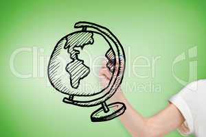 Composite image of businesswoman drawing globe