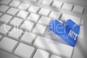 Arts on white keyboard with blue key