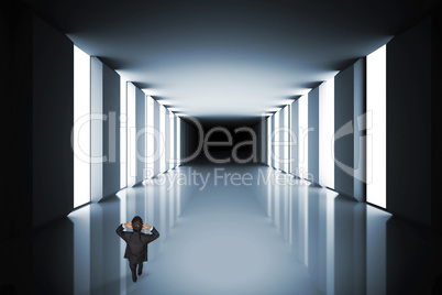 Composite image of stressed businessman with hands on head