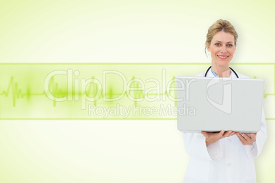 Composite image of blonde doctor using laptop