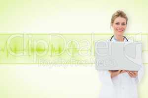 Composite image of blonde doctor using laptop